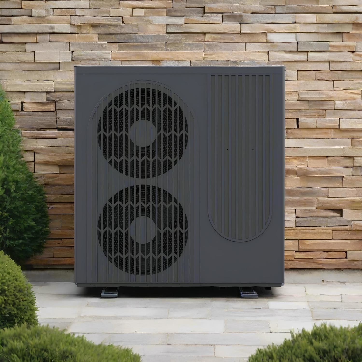 Air source heat pump unit installed against a stone wall